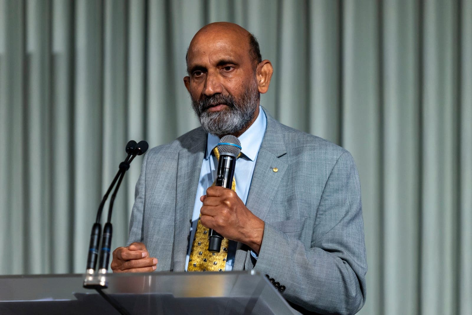 A speaker addressing guests at the 2025 ICNASA Gala Dinner