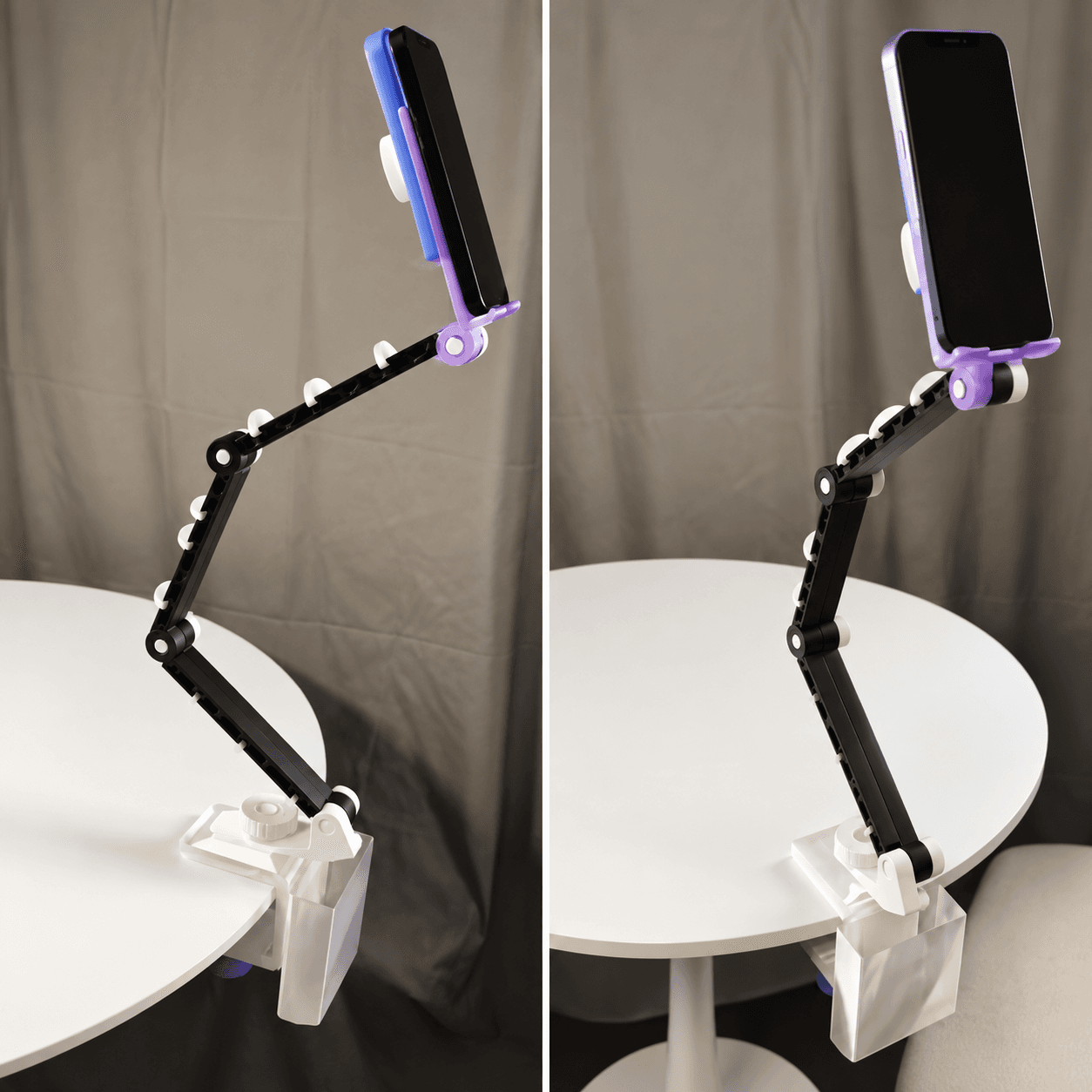 Articulated device stand holding a phone on a desk